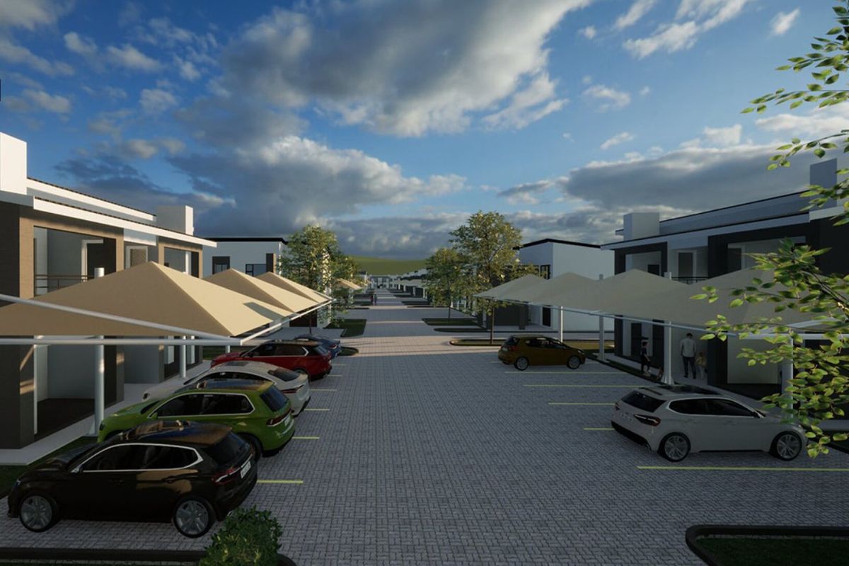 A digital rendering of a modern townhouse complex featuring paved parking areas with shade sail structures and contemporary building facades.