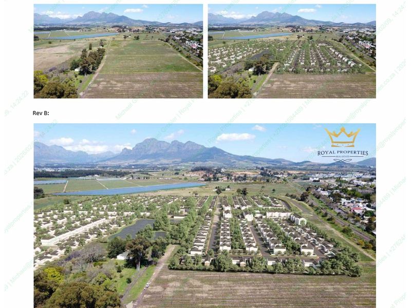 Aerial view of a residential development site featuring mountain views and planned housing infrastructure.