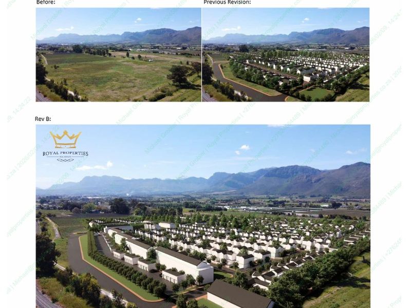 An aerial view showing a residential development project with paved roads and mountain views in the background.