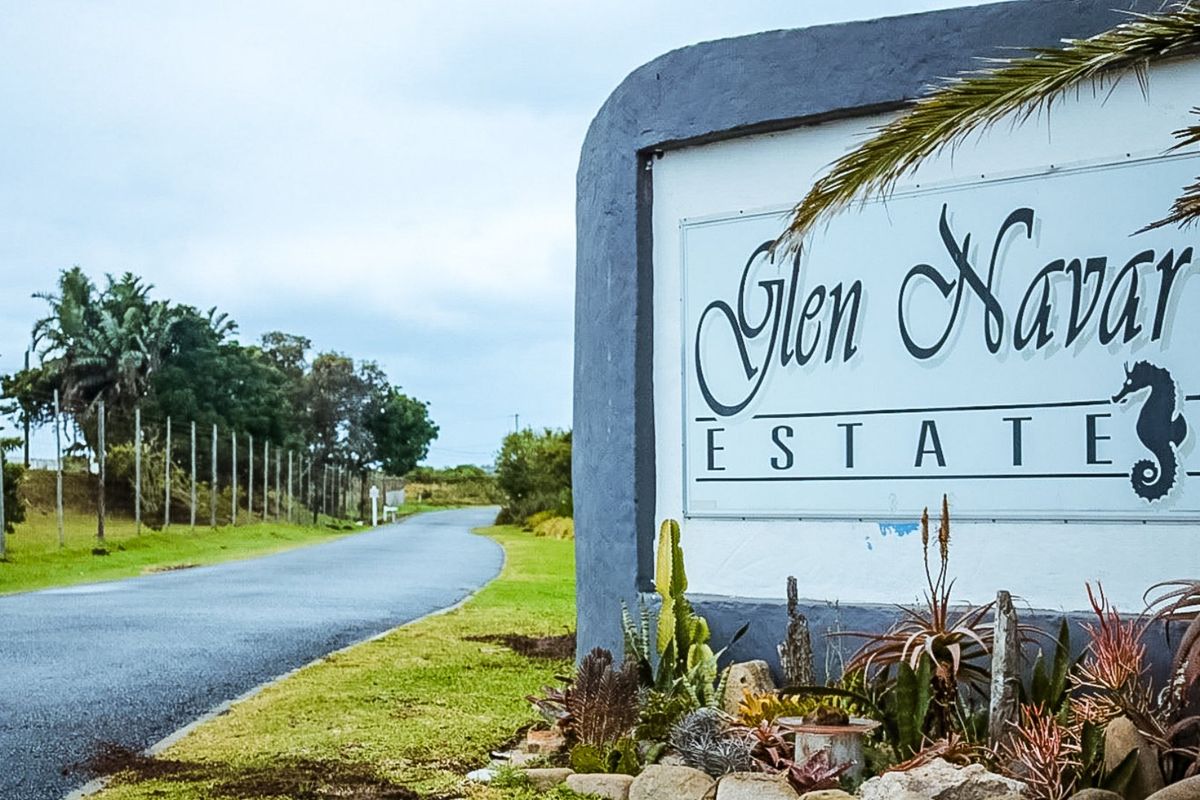 Entrance view of Glen Navar Estate featuring the main signage, asphalt access road, and perimeter fencing.