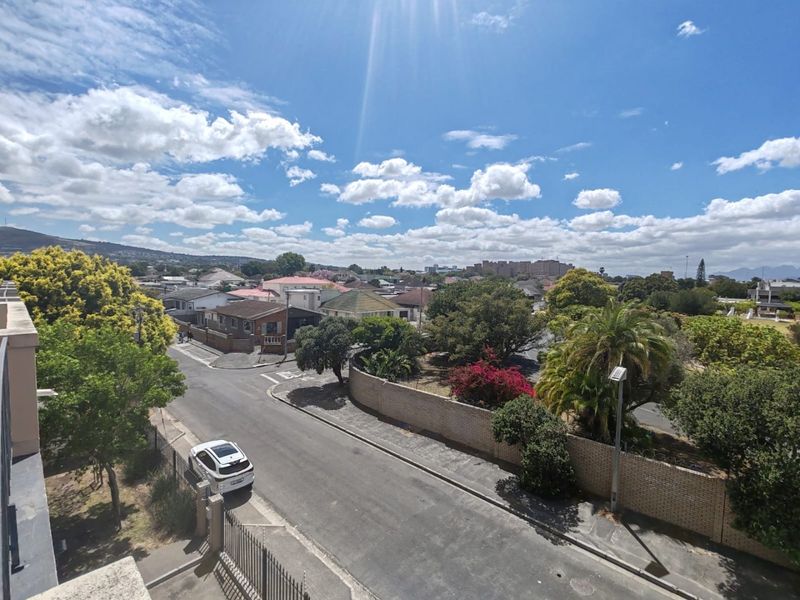 An elevated outdoor view overlooking the surrounding neighbourhood streets, residential properties, and landscaped greenery.