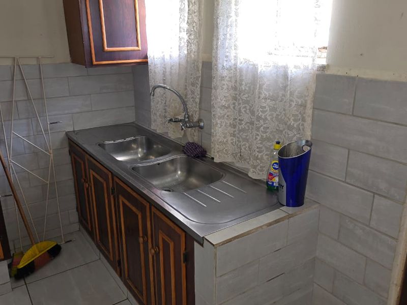 Solid house in fair condition in a popular part of Stilfontein. - Photo 8