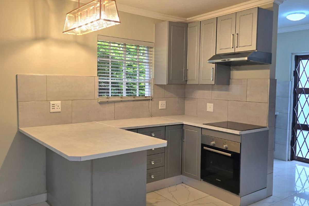 BEAUTIFUL DUPLEX IN WELL MAINTAINED COMPLEX - Photo 4