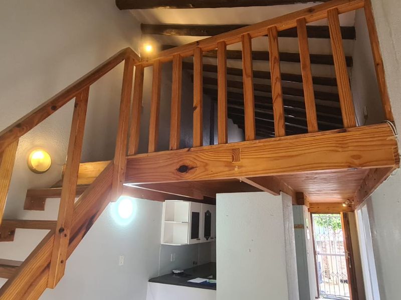 Cozy Living with a Twist: 2-Bedroom Loft Townhouse with Quaint Garden - Photo 7