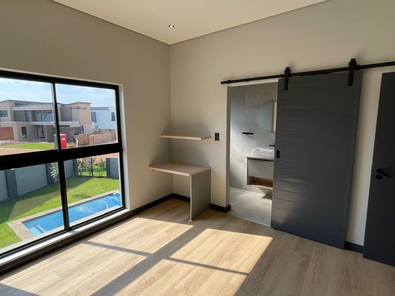 Contemporary 4 Bedroom Family Home | Covered Patio with Braai | Pool | Double Garage - Photo 9