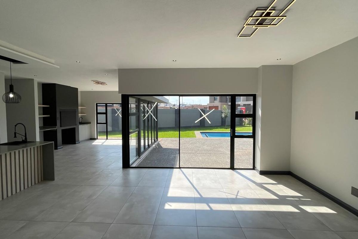 Contemporary 4 Bedroom Family Home | Covered Patio with Braai | Pool | Double Garage - Photo 5