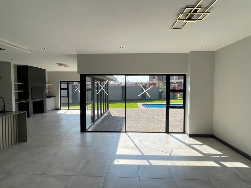 Contemporary 4 Bedroom Family Home | Covered Patio with Braai | Pool | Double Garage - Photo 5