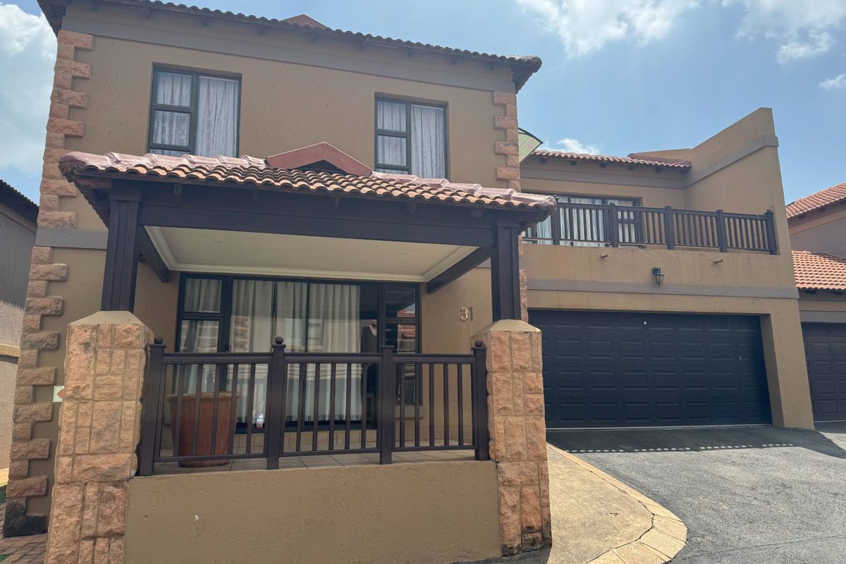 This charming 3-bedroom, 2.5-bathroom townhouse is situated in a secure estate, offering both comfort and privacy. - Photo 3