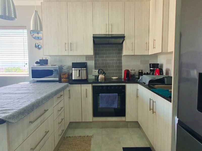 Low-Maintenance Coastal Living in Pet-Friendly Eco Estate - Photo 7