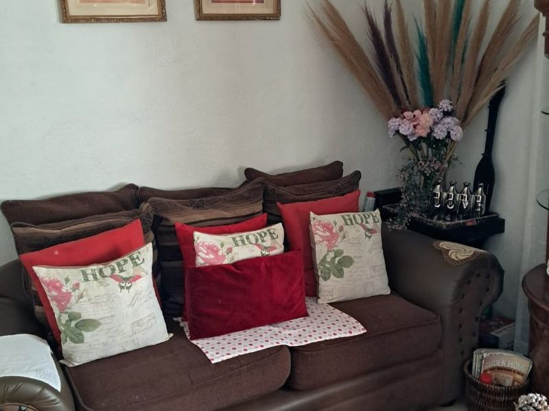 A view of a living room area featuring textured wall finishes.