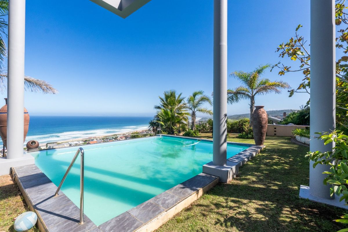 ELEVATED 7 BEDROOM COASTAL MASTERPIECE WITH INCOME POTENTIAL & UNINTERRUPTED OCEAN VIEWS - Photo 2