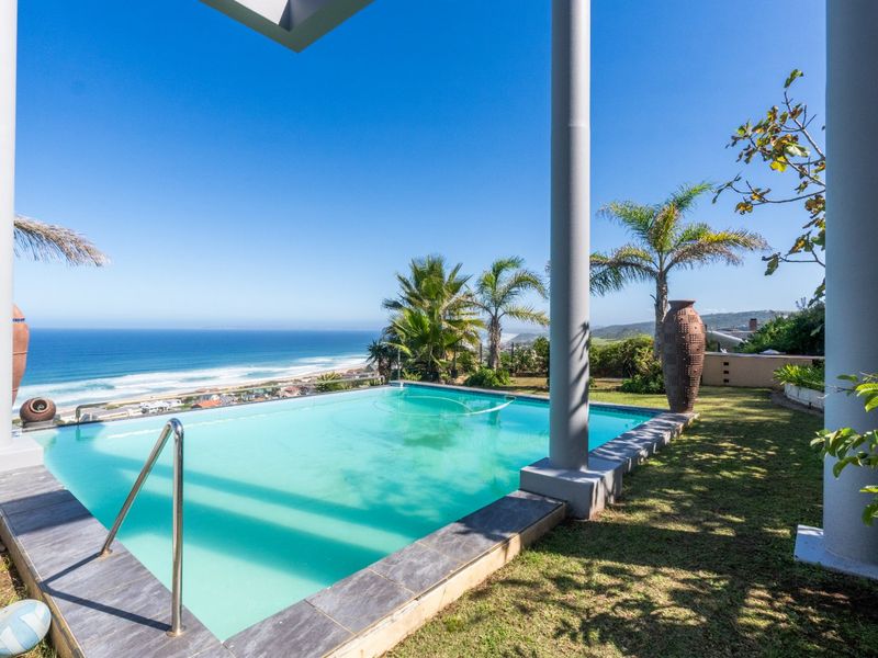 ELEVATED 7 BEDROOM COASTAL MASTERPIECE WITH INCOME POTENTIAL & UNINTERRUPTED OCEAN VIEWS - Photo 2