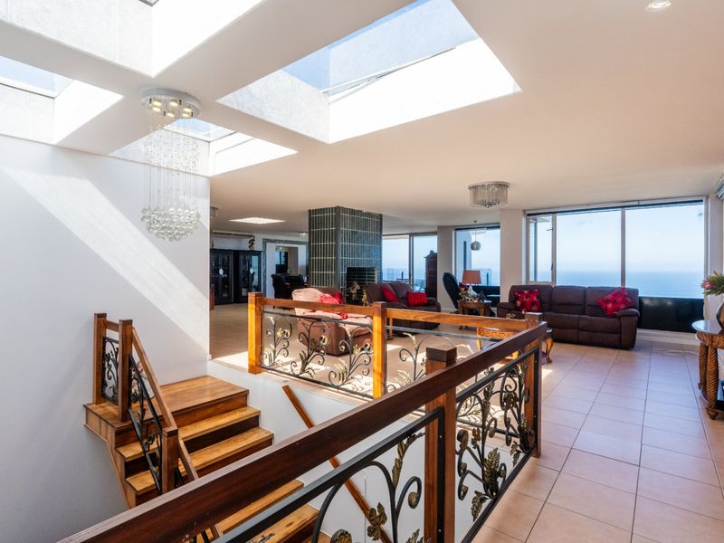 ELEVATED 7 BEDROOM COASTAL MASTERPIECE WITH INCOME POTENTIAL & UNINTERRUPTED OCEAN VIEWS - Photo 9