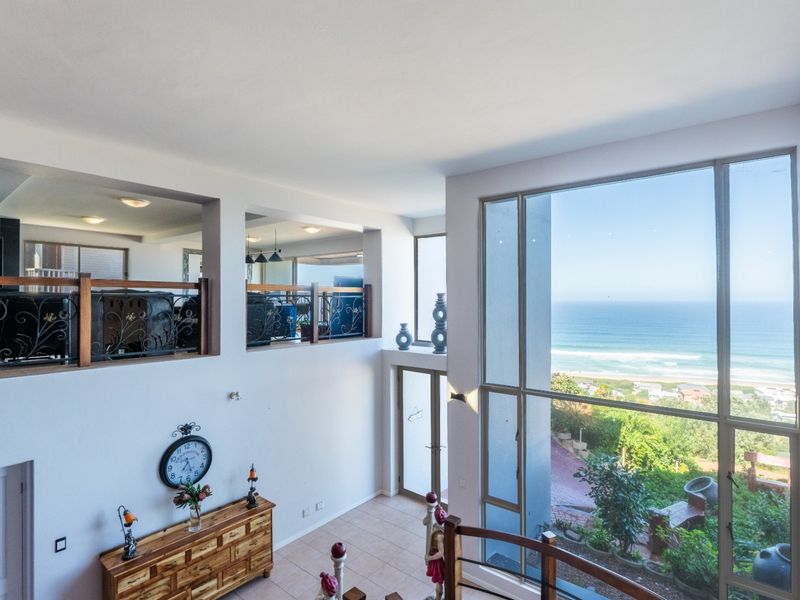ELEVATED 7 BEDROOM COASTAL MASTERPIECE WITH INCOME POTENTIAL & UNINTERRUPTED OCEAN VIEWS - Photo 5