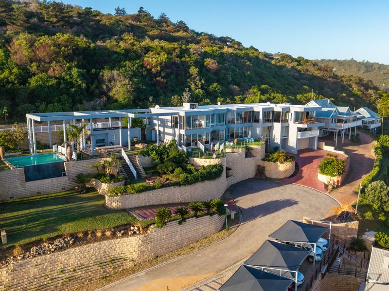 ELEVATED 7 BEDROOM COASTAL MASTERPIECE WITH INCOME POTENTIAL & UNINTERRUPTED OCEAN VIEWS - Photo 1