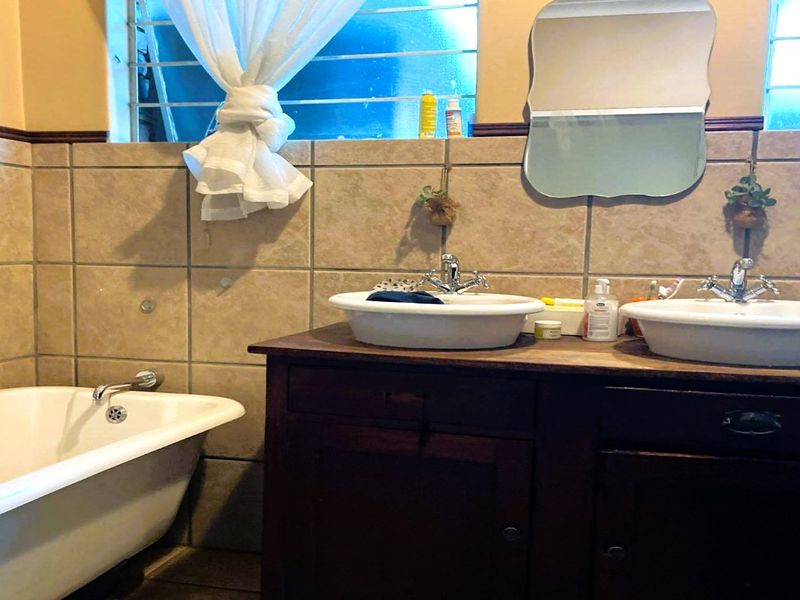 Discover exceptional family living in the heart of Lyttelton Manor, one of Centurion’s most established and sought-after suburbs. This spacious 4-bedroom home offers the perfect balance of comfort, functionality, and timeless charm—ideal for growing families or buyers looking for extra space to work and entertain. - Photo 5