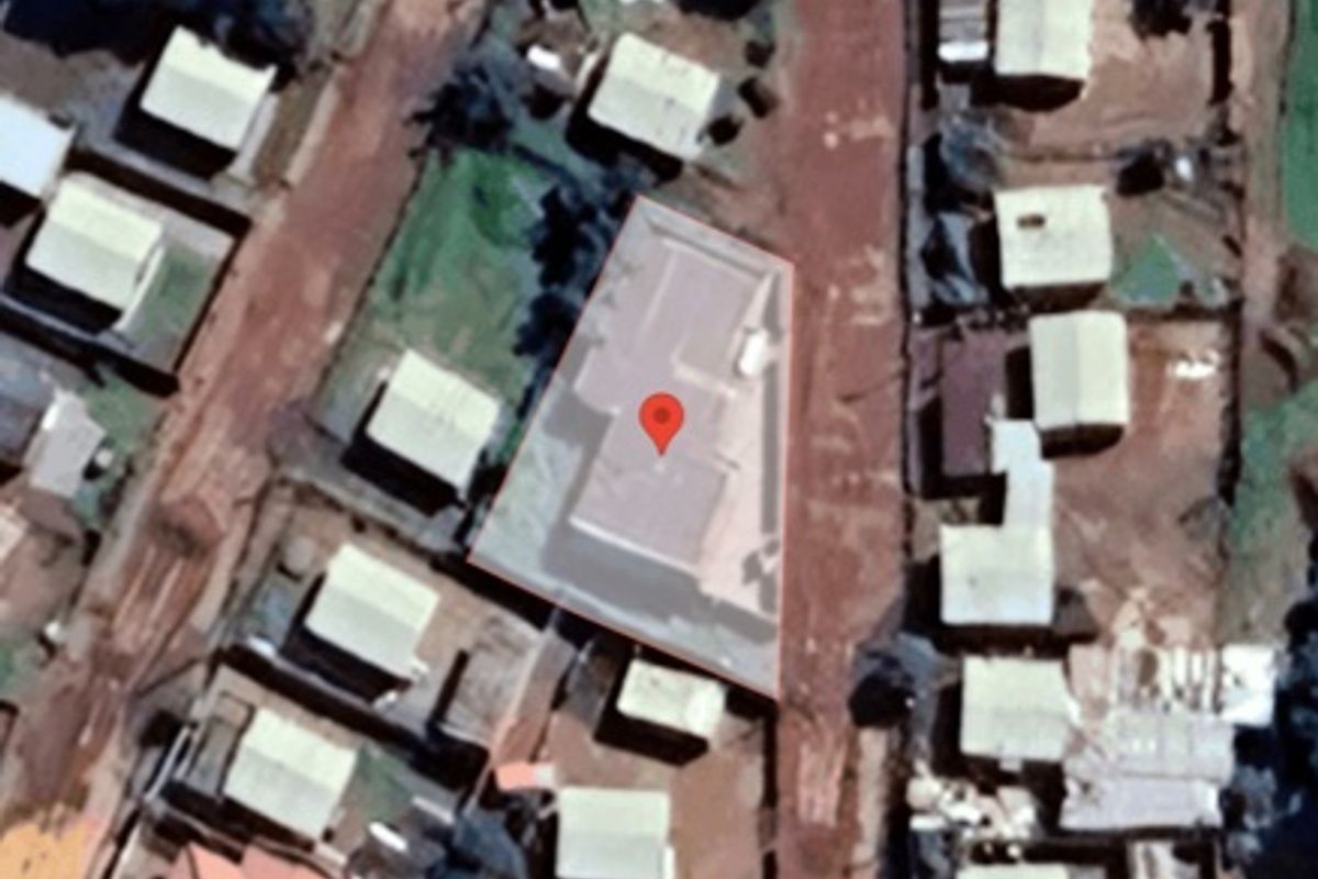 An aerial satellite view showing the property plot, roof structure, and surrounding residential neighbourhood layout.