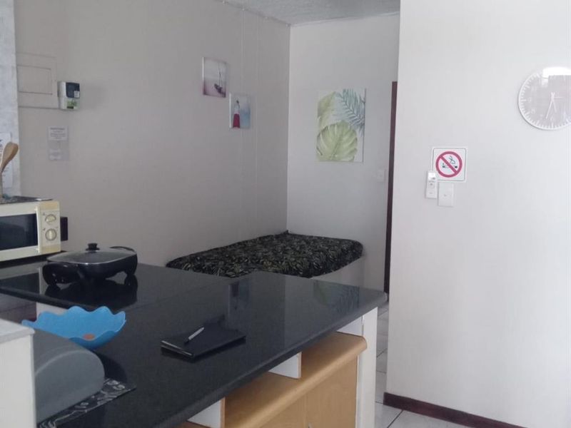 Coastal Flat with Sea Views and Veranda Vibe - Photo 5