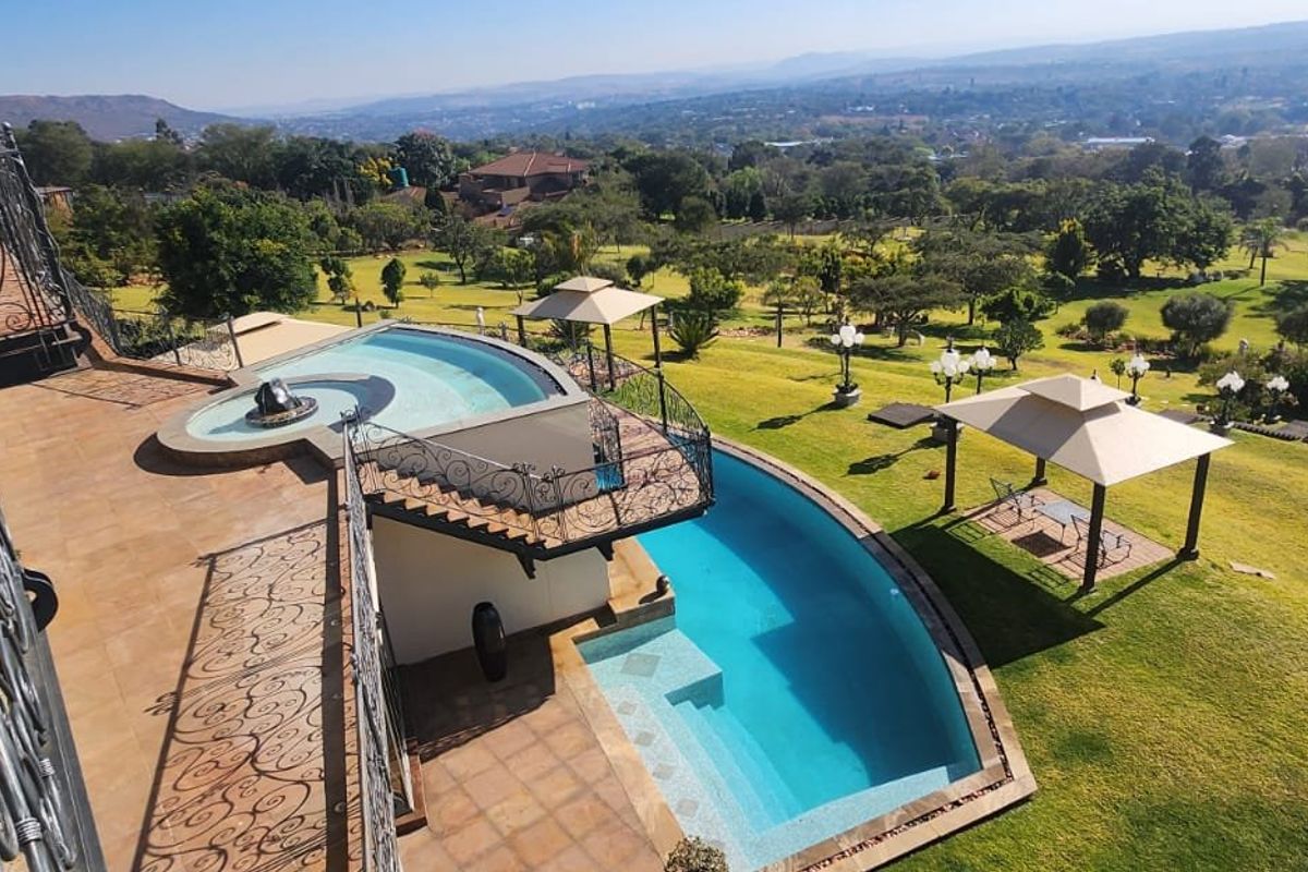 Hilltop Masterpiece with Panoramic Views & Development Potential | Poortview - Photo 2