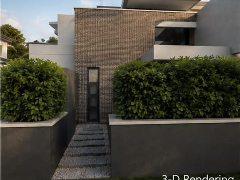 A modern architectural exterior featuring stone cladding, clean lines, and structured landscaping leading to the main entrance.