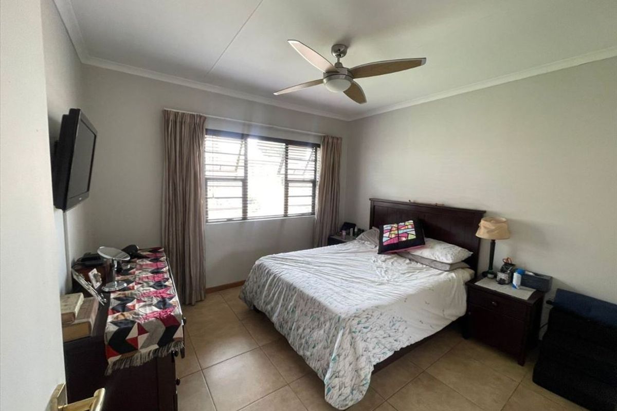 Comfortable Three-Bedroom Home with Practical Living Spaces - Photo 2