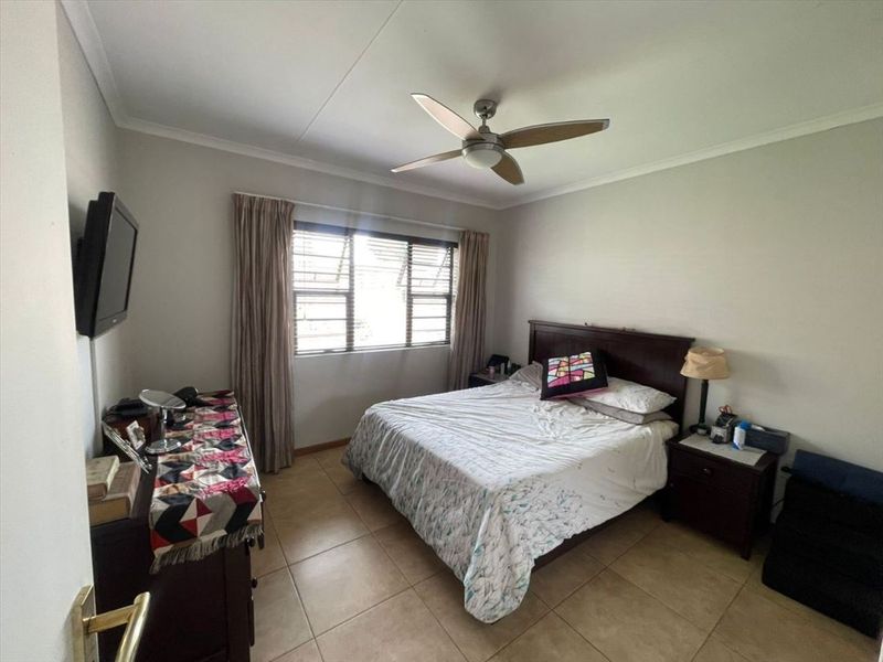 Comfortable Three-Bedroom Home with Practical Living Spaces - Photo 2