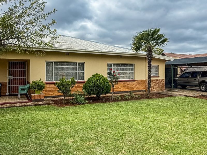 Solid Family Home with Spacious Living & Exceptional Outbuildings - Photo 4
