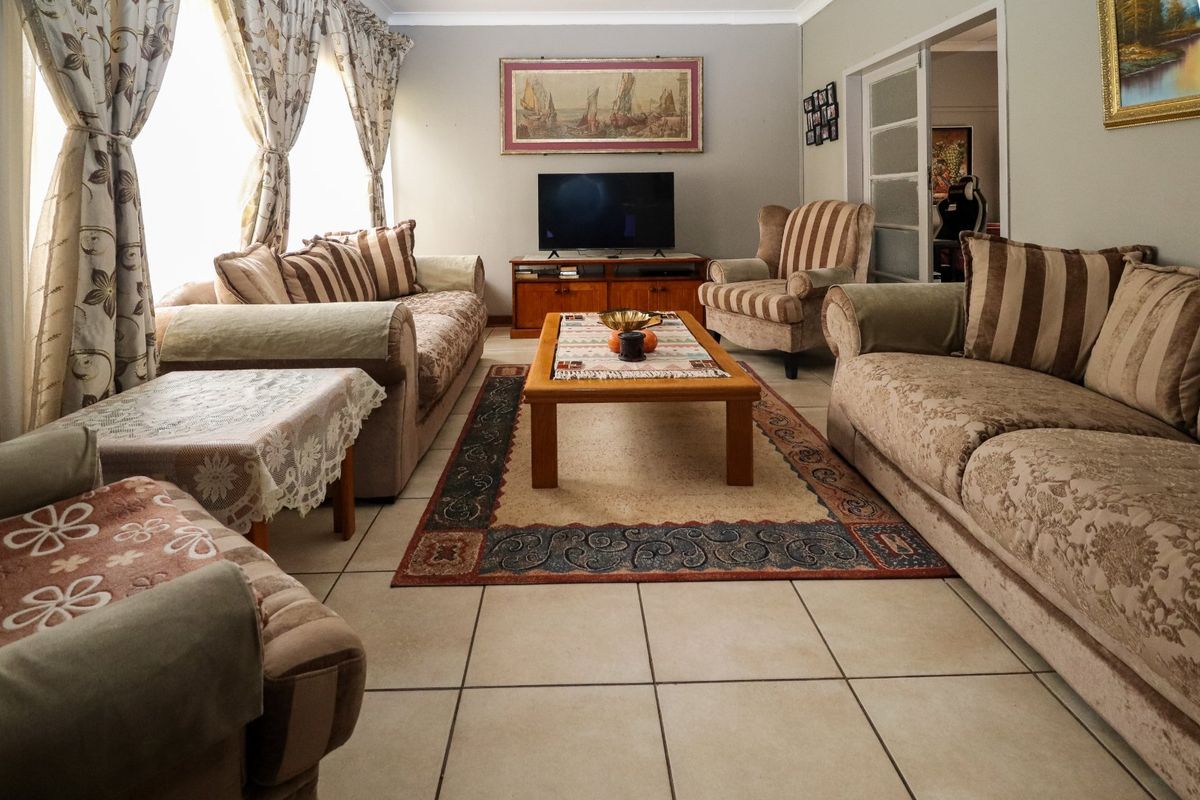 Solid Family Home with Spacious Living & Exceptional Outbuildings - Photo 5