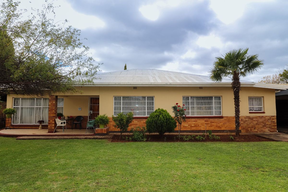 Solid Family Home with Spacious Living & Exceptional Outbuildings - Photo 3
