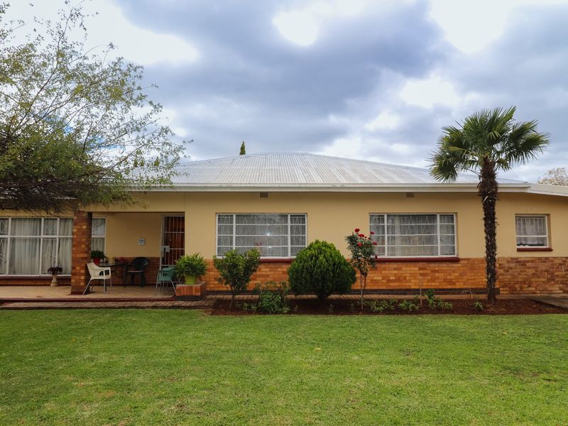 Solid Family Home with Spacious Living & Exceptional Outbuildings - Photo 3