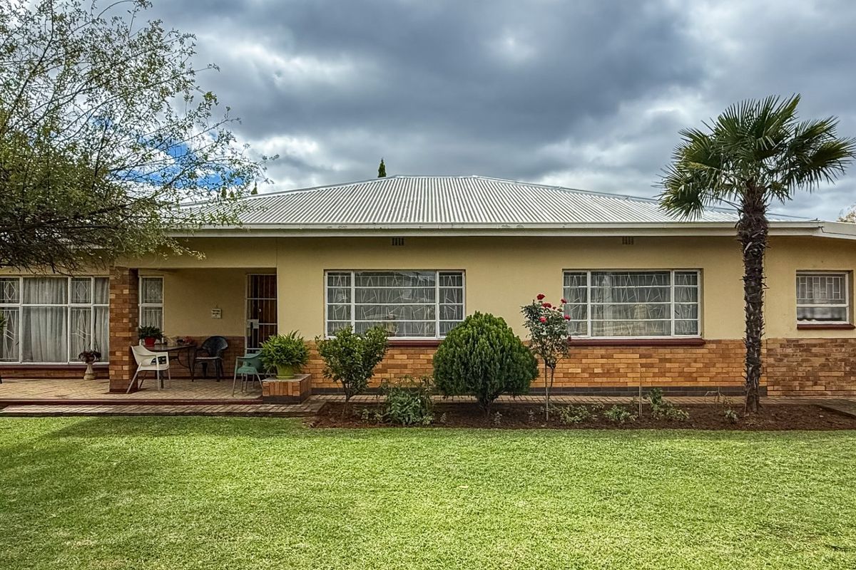 Solid Family Home with Spacious Living & Exceptional Outbuildings - Photo 2