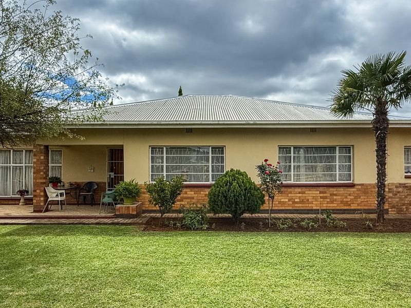 Solid Family Home with Spacious Living & Exceptional Outbuildings - Photo 2