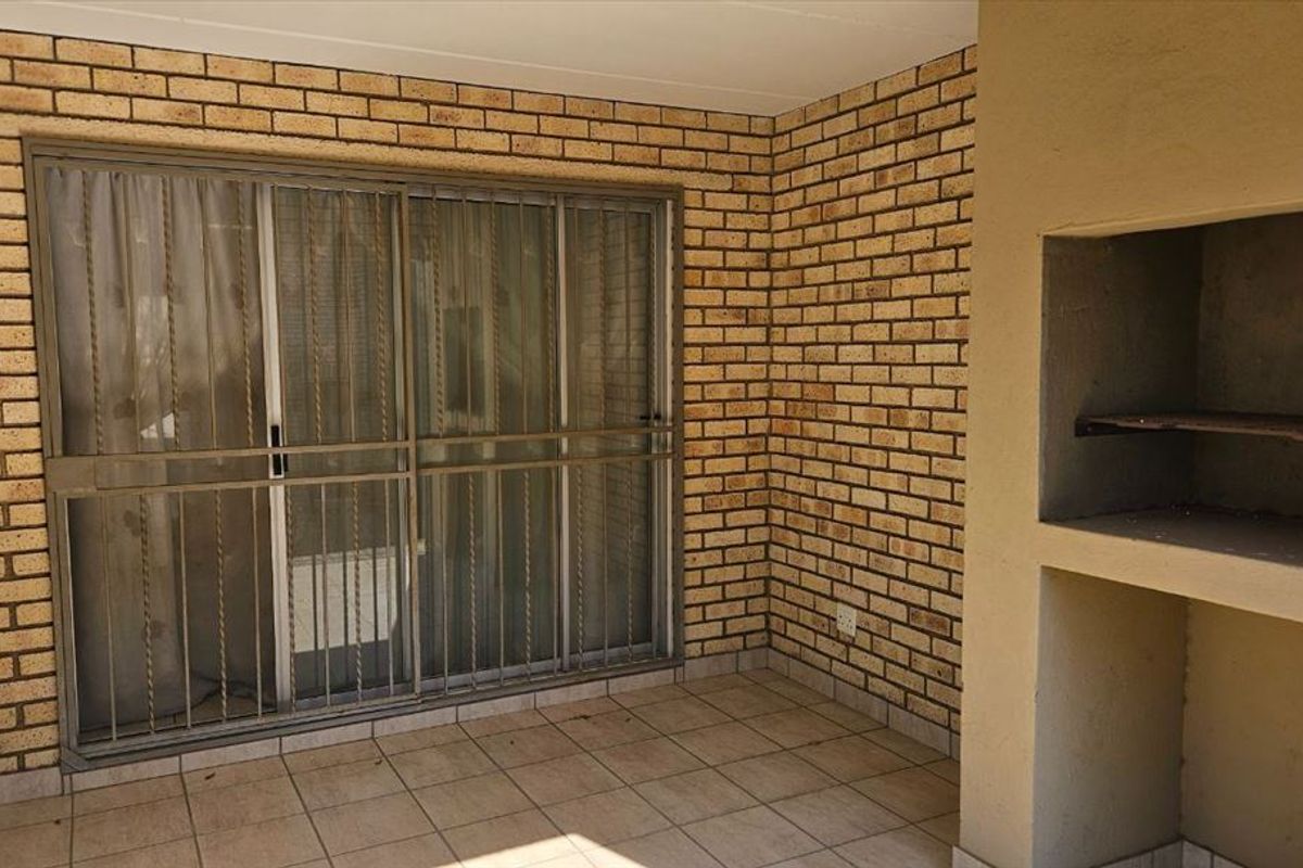Modern Three-Bedroom Home with Secure Carports - Photo 3