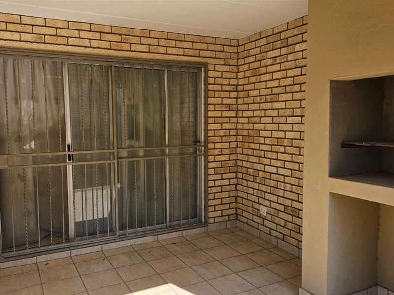 Modern Three-Bedroom Home with Secure Carports - Photo 3
