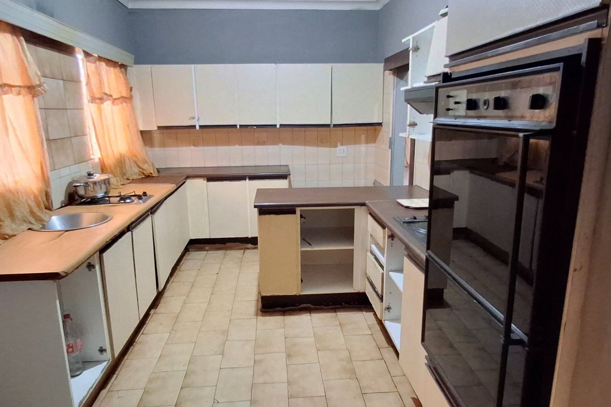 FIXER-UPPER LARGE HOUSE WITH FLAT FOR SALE IN ORCHARDS - Photo 3