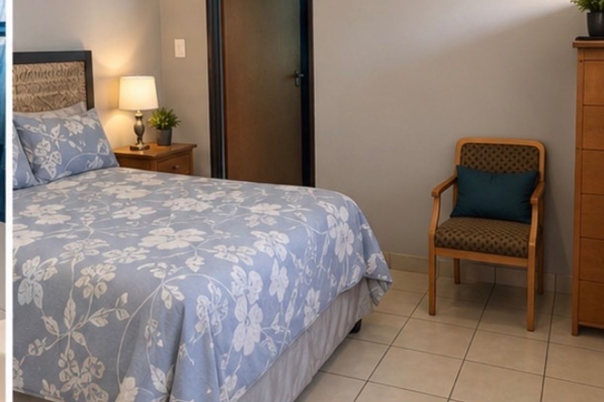 A functional bedroom featuring neutral wall paint, tiled flooring, and classic cove cornicing, providing a clean and simple living space.