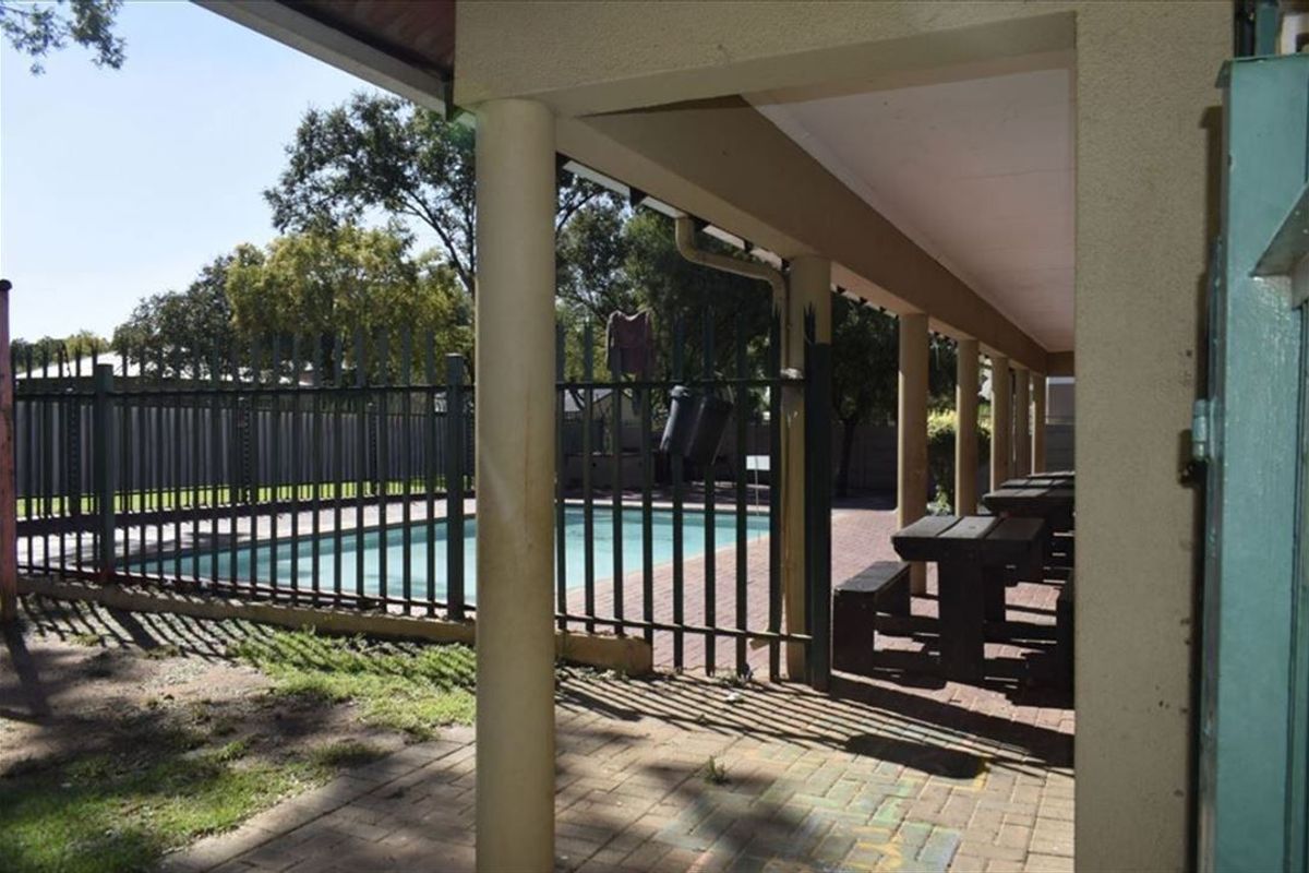 Charming Home with Pool and Practical Living Spaces - Photo 3