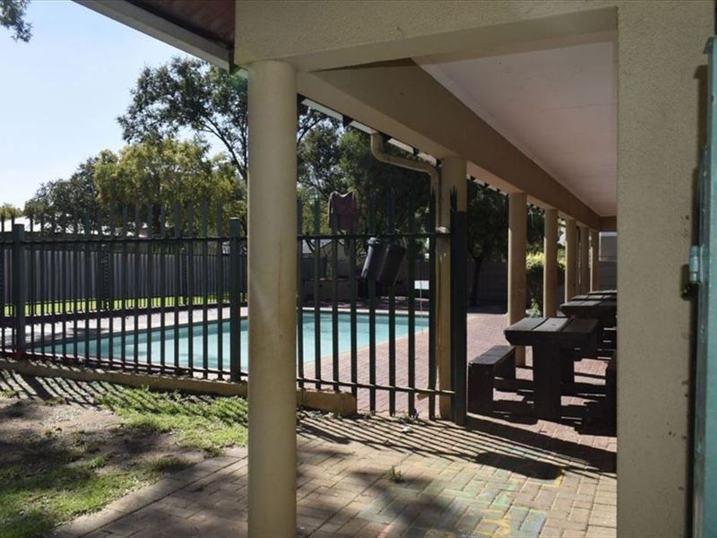 Charming Home with Pool and Practical Living Spaces - Photo 3