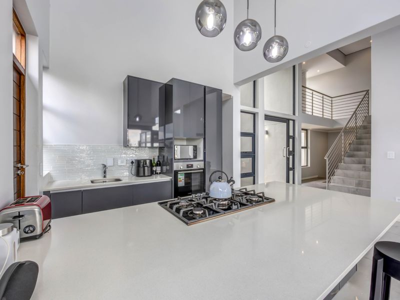 Modern Double-Story Home | 3 Bed | 3 Bath | High Ceilings & Expansive Glass | Jackal Creek Golf Estate | Fairway Views - Photo 4