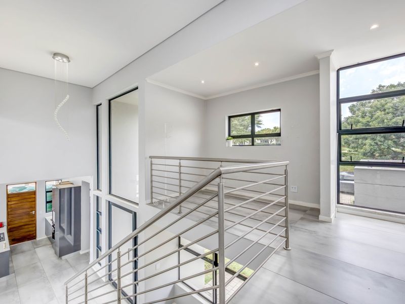 Modern Double-Story Home | 3 Bed | 3 Bath | High Ceilings & Expansive Glass | Jackal Creek Golf Estate | Fairway Views - Photo 7