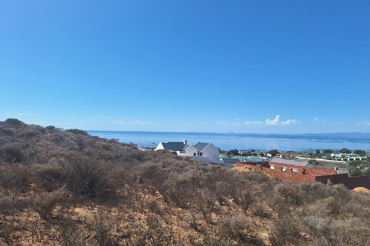 A scenic view overlooking the coastal landscape and ocean from the vacant residential land.