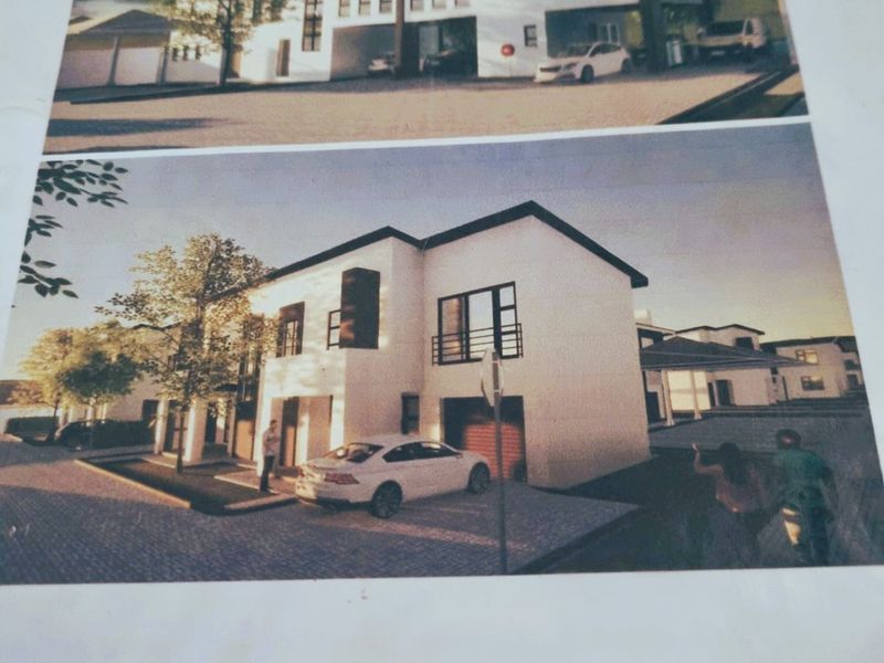 Architectural rendering of The Clarinet residential development in Hartbeespoort, showcasing modern townhouse facades, paved driveways, and integrated garage structures.