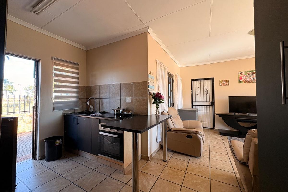 Low-maintenance 2-bedroom facebrick home with a built-in braai, modern finishes, prepaid electricity, and excellent security in Stilfontein Extension 4. - Photo 3