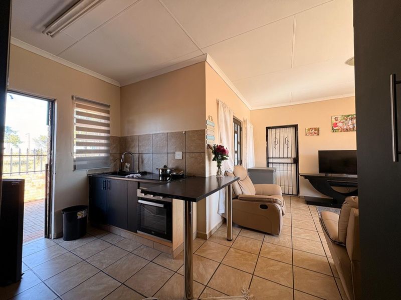 Low-maintenance 2-bedroom facebrick home with a built-in braai, modern finishes, prepaid electricity, and excellent security in Stilfontein Extension 4. - Photo 3
