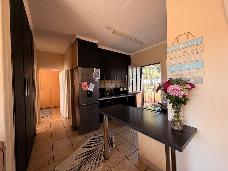 Low-maintenance 2-bedroom facebrick home with a built-in braai, modern finishes, prepaid electricity, and excellent security in Stilfontein Extension 4. - Photo 2
