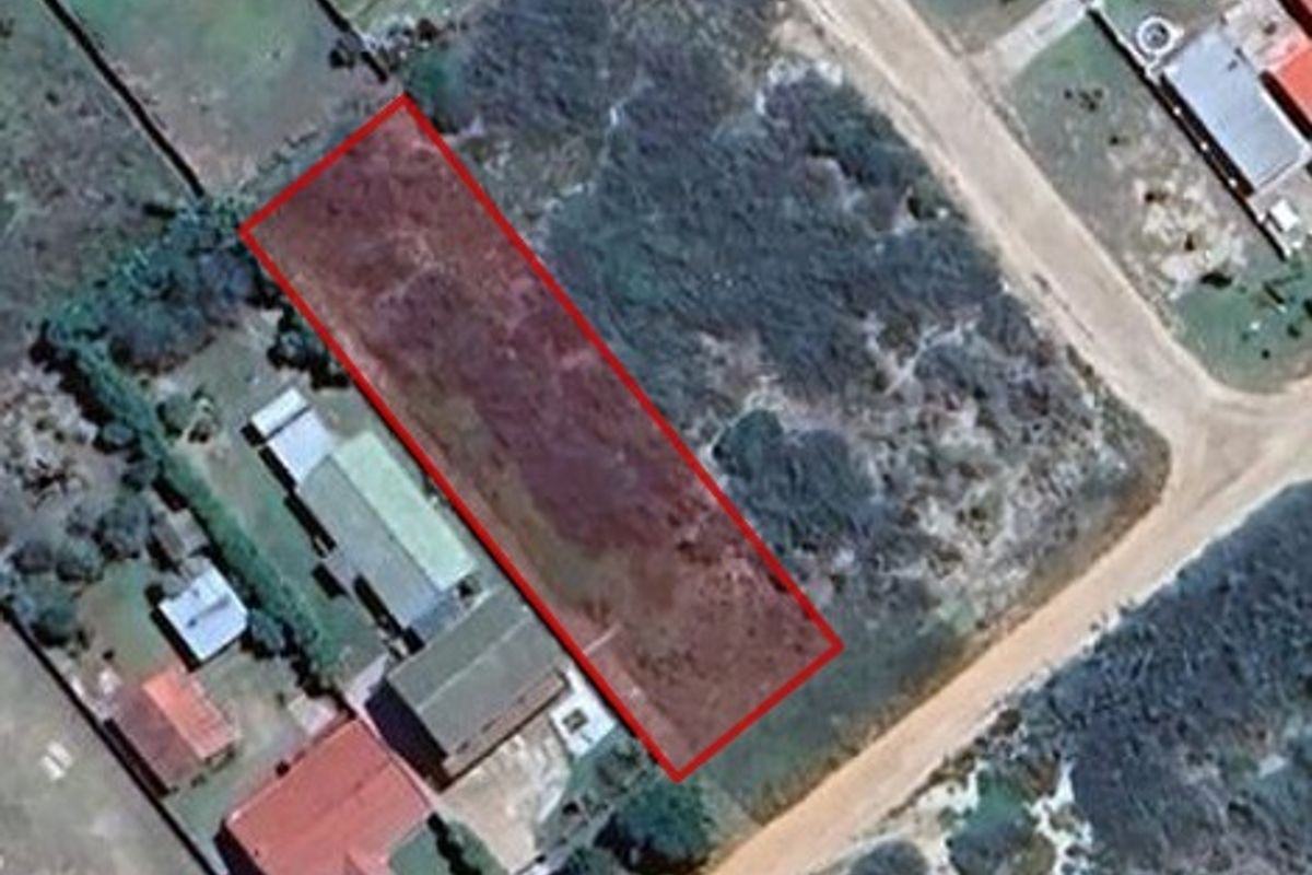 An aerial view showing a rectangular plot of vacant residential land with clear boundary markings in a suburban neighborhood.