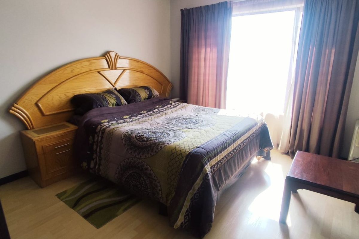 SECURE 2-BEDROOM PET-FRIENDLY APARTMENT WITH MAIN EN-SUITE, COMMUNAL POOL, AND 24-HOUR SECURITY - Photo 5