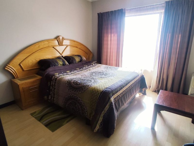 SECURE 2-BEDROOM PET-FRIENDLY APARTMENT WITH MAIN EN-SUITE, COMMUNAL POOL, AND 24-HOUR SECURITY - Photo 5