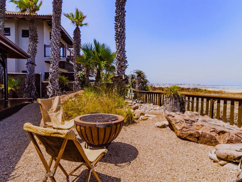 Exceptional Knysna-Style Beachfront Retreat for Coastal Living in Melkbosstrand Central - Photo 1