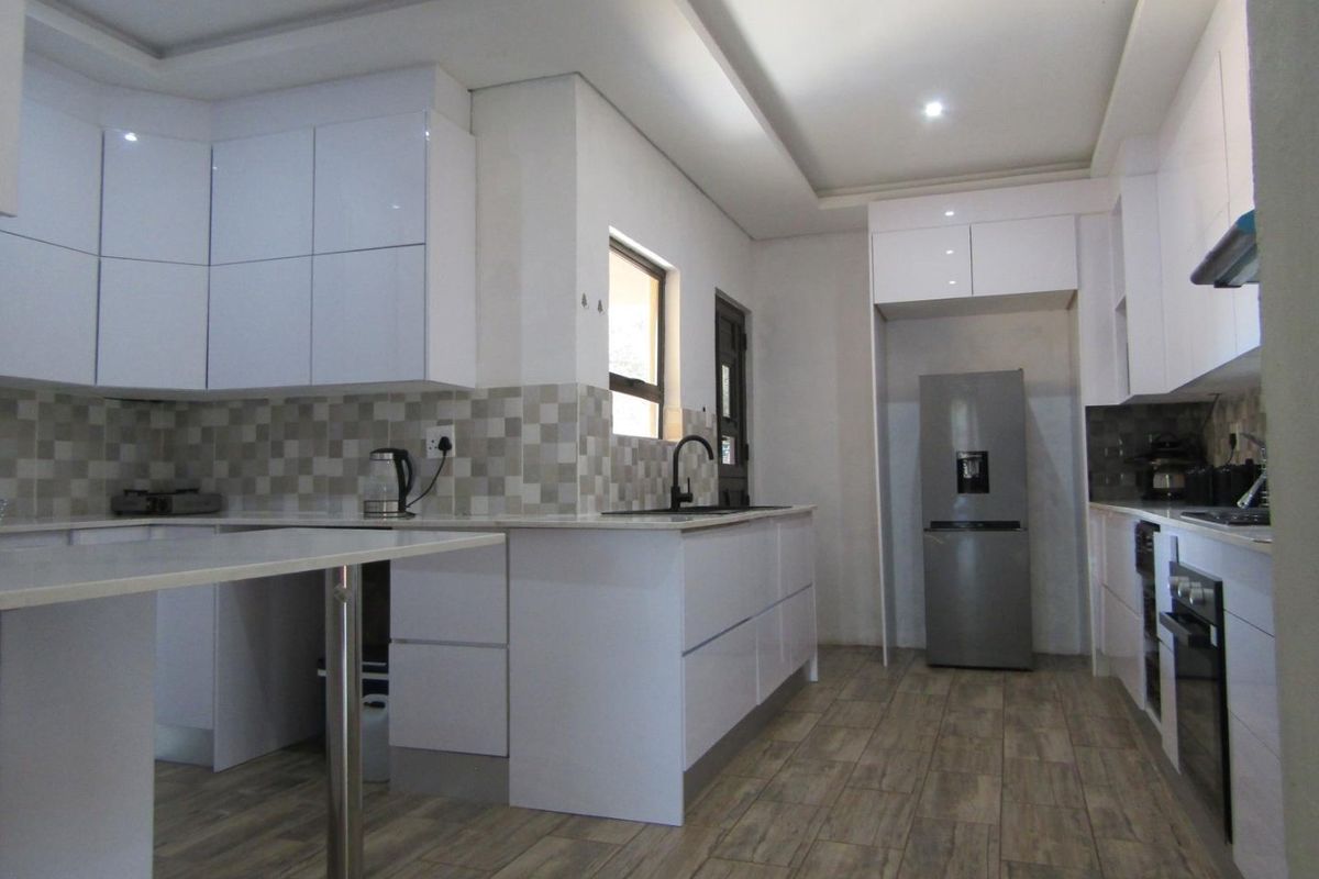 This property is just as lovely as the outside. As soon as you walk in the front door, you’re greeted by a warm and welcoming atmosphere. The house is spacious and has big aluminium windows that let in lots of natural light. - Photo 2